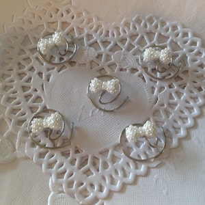 Flower girls hair swirls, pearl bows hair spins, twists, coils, spirals, spin pins, brides, bridesmaids