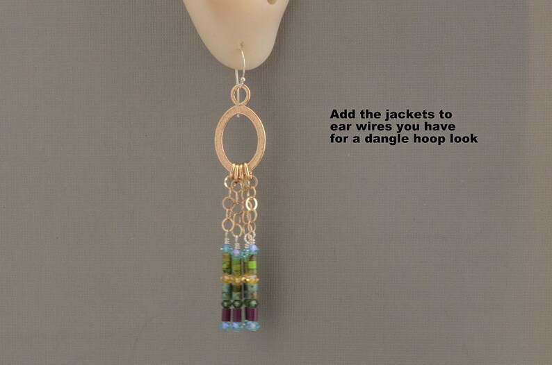 May include: Gold hoop earrings with a dangling chain of beads in shades of green, blue, and purple. "Add the jackets to ear wires you have for a dangle hoop look" is written in the image.