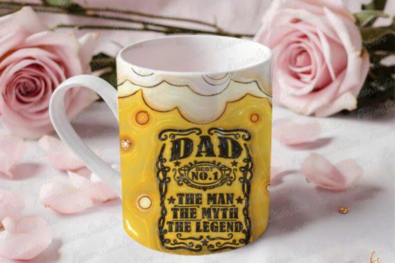 May include: A white ceramic mug with a yellow and brown design. The mug features the text "DAD BEST NO. 1 THE MAN THE MYTH THE LEGEND" in black. The mug is decorated with a beer-like design.