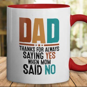 May include: White ceramic mug with a red interior and handle. The mug features the word "DAD" in brown and teal block letters, with the text "THANKS FOR ALWAYS SAYING YES WHEN MOM SAID NO."