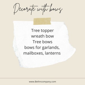 May include: A white note with the text "Decorate with bows" at the top and a list of uses for bows: "Tree topper, wreath bow, Tree bows, bows for garlands, mailboxes, lanterns". The note is on a beige background and has a piece of tape at the top.