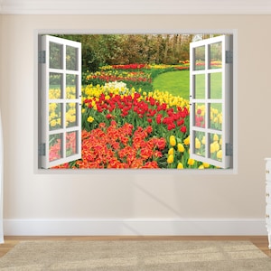 May include: A wall mural depicting an open window with a view of a vibrant flower garden. The garden features red, yellow, and orange tulips. The window is white with a grid pattern. The room has beige walls, a white dresser, and a beige rug.