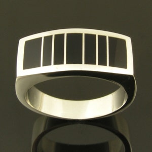 Handmade man&#39;s sterling silver ring inlaid with black onyx.