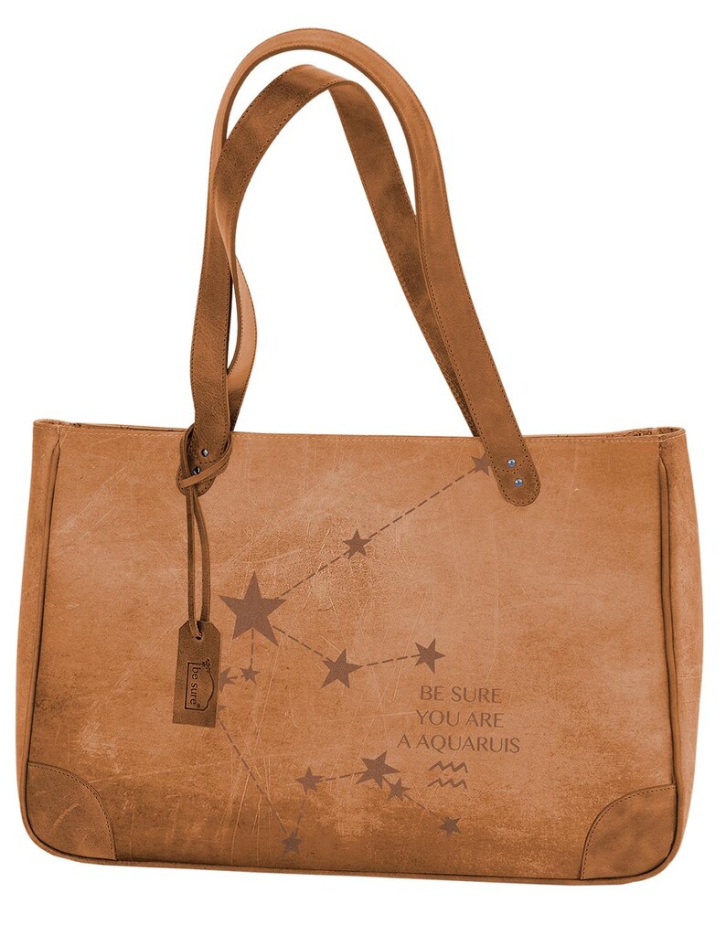 May include: A brown leather tote bag with a constellation design and the text 'Be sure you are an Aquariuis' and the Aquarius zodiac symbol.