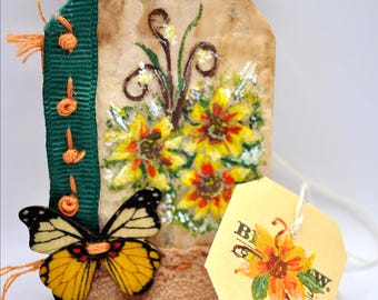 Hand painted wildflowers on a recycled teabag