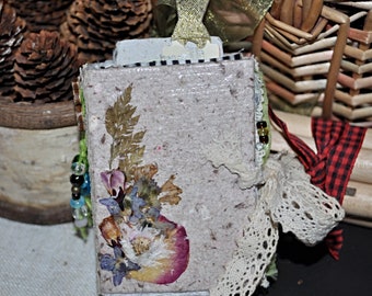 Mini handmade journal made with handmade recycled papers, pressed flowers, recycled glass beads and vintage lace.