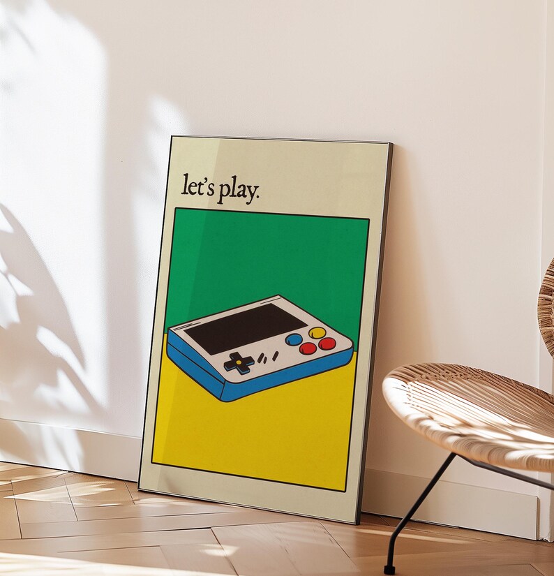 May include: A retro-style video game console with a blue and white design, yellow and green background, and the text "Let's play."