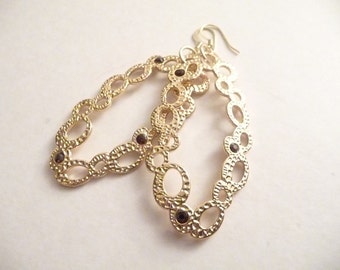 Gold Dangle Earrings: Oval Pendants with Burgundy Crystals