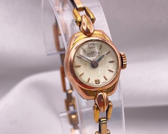 Vintage jaren 50 damescocktailhorloge: roségoudgevulde ronde kast, schakelarmband van het merk Roamer Watch