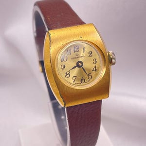 Stylish 1980s Vintage Ladies Wristwatch Gold Plated Rectangular Case Gold Dial Manual Wind New Hirsch Leather Strap by CONTINENTAL