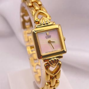 Vintage jaren 1990 dames CITIZEN by Seiko quartz horloge vergulde sierlijke gesp kast dweil wijzerplaat mooie armband band met hartschakels