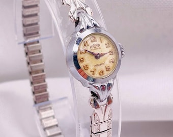 Vintage jaren 1950 Roamer cocktailhorloge voor dames: handmatig opwindbaar, witgouden ronde kast en schakelarmband