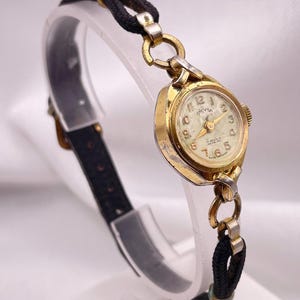 Dainty Vintage 1950&#39;s Tasman Ladies 17 Jewel Wind Up Cocktail Wristwatch 10 Kt Gold Filled Case Original Cable Leather Bracelet Strap