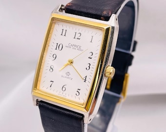 Vintage jaren 1990 uniseks quartzhorloge: tweekleurige rechthoekige kast, leren band van het merk Caprice