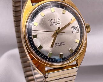 Vintage jaren 70 Zwitsers automatisch horloge: 25 juwelen, blauw/gouden wijzerplaat, vergulde ronde kast en band van Royle