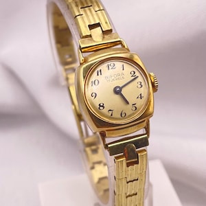 Vintage Stylish 1960s BIFORA 17 Jewel Manual Wind Ladies Wristwatch Gold Plated Cushion Case Gold Dial Fancy Textured Bracelet Strap