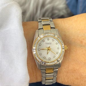Vintage 1990s Ladies CARAVELLE by Bulova Two Tone Stainless Steel Crystal Encrusted Bezel with Mother of Pearl Dial Quartz Wristwatch