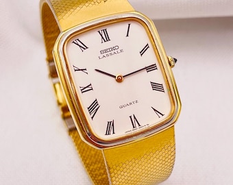 Vintage jaren 80 SEIKO LASSALE, uniseks ultradun kwarts, referentie 6020-5839. Vergulde rechthoekige kast, geïntegreerde band, met doos