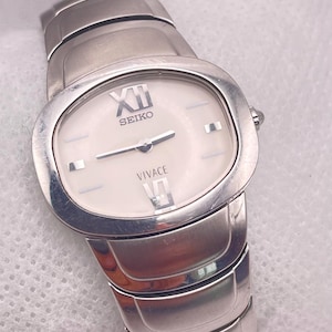 2000s Vintage Ladies SEIKO Vivace Quartz Wristwatch Stainless Steel T.V. Case  White Dial with Seiko Stainless Steel Shaped Watch Strap
