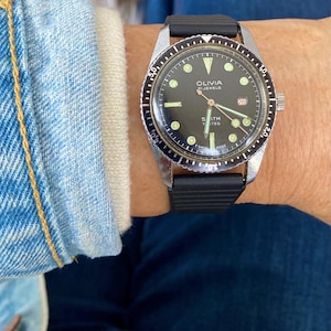 1970s Vintage OLIVIA Wristwatch Swiss Made 21 Jewel Manual Wind Diver Wristwatch Black Dial  Rotating Bezel.