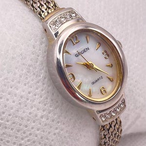 1990s Vintage GRUEN Ladies Quartz Wristwatch Silver Tone Dainty Oval Case Mother of Pearl Dial with Mesh Bracelet Strap - New Battery