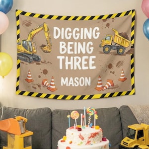 ✨ Build the perfect birthday celebration for your little guy! ✨

Make his milestone a smashing success with this personalized construction-themed birthday banner 🚧🚜
Featuring a cool yellow excavator, a hardworking dump truck, traffic cones, and playful dirt splatters, this fabric tapestry creates an exciting and adventurous atmosphere for his special day.