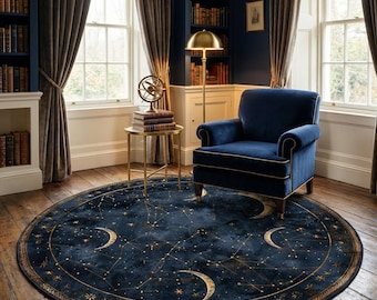 May include: A round, navy blue rug with a celestial design featuring gold stars, constellations, and crescent moons. The rug is placed in a room with a blue armchair, a gold side table, and a floor lamp. The room has large windows and bookshelves.