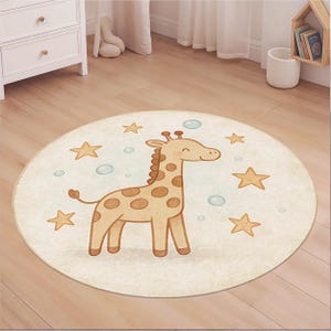 May include: A round, cream-colored rug featuring a cartoon giraffe with brown spots and a light brown mane. The rug is decorated with gold stars and light blue bubbles, creating a playful design for a nursery or playroom.