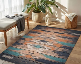 May include: A rectangular area rug with a distressed wood plank design. The rug features horizontal stripes in shades of navy, orange, teal, and cream. The rug is placed on a hardwood floor, with a bench and plants in the background.