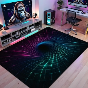 May include: A black area rug with a vibrant, swirling design. The rug features a central vortex effect with a grid pattern, transitioning from pink to blue and green hues. The rug is placed on a light-colored wooden floor.
