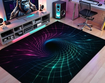 May include: A black area rug with a vibrant, swirling design. The rug features a central vortex effect with a grid pattern, transitioning from pink to blue and green hues. The rug is placed on a light-colored wooden floor.