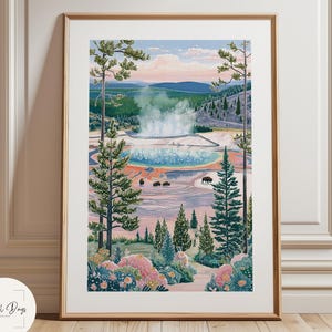 May include: A framed art print showcasing a landscape with a geyser and surrounding scenery. The artwork uses a vibrant colour palette with blues, greens, pinks, and browns. The print is displayed in a wooden frame and is set against a white wall.