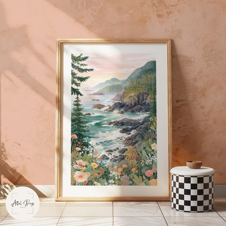 May include: A framed watercolor print depicts a coastal landscape with a vibrant sea, rocky cliffs, and lush greenery. The artwork features a palette of blues, greens, and soft pinks, with a touch of yellow and white flowers in the foreground. The frame is a light wood color.