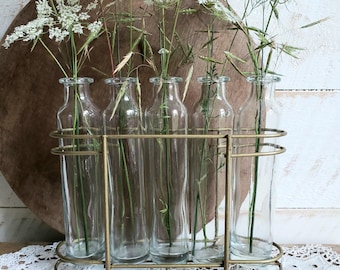 propagation station or infused oil bottles , vintage glass bottles in wire rack , farmhouse bud vases