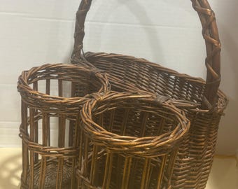 vintage multi-compartment wicker basket featuring an integrated rear storage basket and two front cylindrical holders.