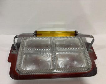 vintage,  divided relish tray also called an appetizer or condiment server.Handle is  amber or translucent Bakelite