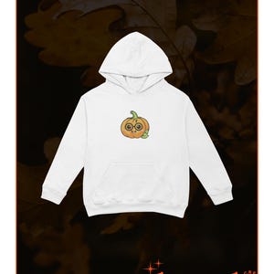 May include: White hoodie with a cartoon pumpkin wearing glasses. The pumpkin is orange with a green stem and leaves.