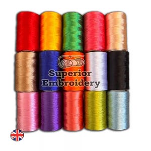 May include: A set of 15 spools of embroidery thread in various colours, including red, orange, yellow, green, blue, purple, pink, brown, black, and white. The spools are arranged in three rows of five. The text "Superior Embroidery" is printed on the bottom row of spools.