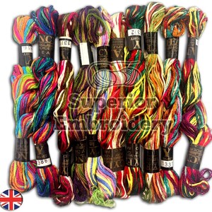 May include: A collection of 10 skeins of embroidery floss in various colours, including red, green, blue, yellow, and purple. Each skein is labelled with the brand name "Y.A.IGHT" and a number. The skeins are arranged in a semi-circle.
