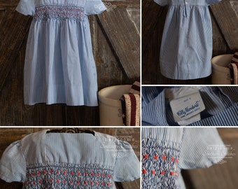 Vintage blue stripe smocked girls dress made by Polly Flinders.