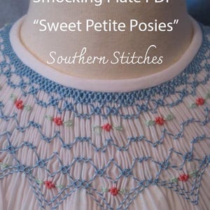May include: Close-up of a light pink fabric with blue and red embroidered details. The design features a smocked pattern with floral accents. Text on the image reads "Smocking Plate PDF", "Sweet Petite Posies", and "Southern Stitches".