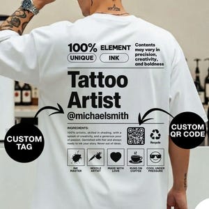 May include: White t-shirt with black text that reads "Tattoo Artist @michaelsmith." The shirt also features a QR code and icons representing ink, needles, love, coffee, and cool under pressure. The shirt is a unique element.