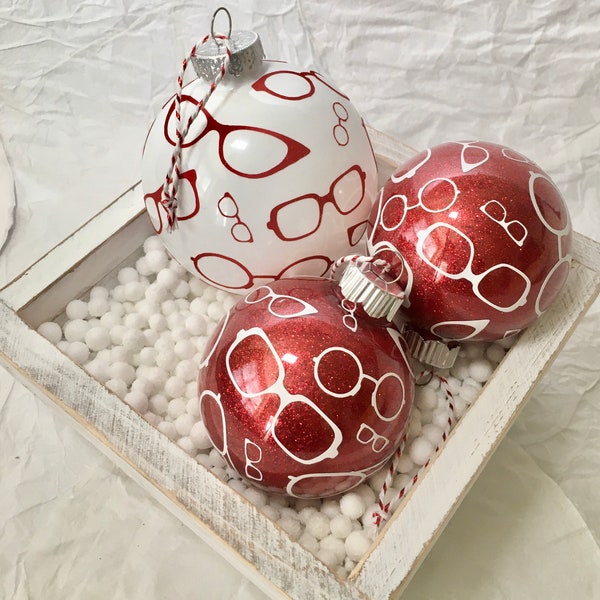 Adorno de gafas rojas y blancas, rojo brillante, redondo, de plástico.