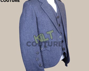 May include: A blue wool kilt jacket with black buttons and a black and white striped trim on the sleeves. The jacket is part of a three-piece suit.