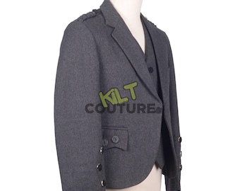 May include: A grey tweed kilt jacket with a single button closure and a single pocket on the left side. The jacket has a traditional kilt design with a flap on the back and a decorative button on the sleeve. The jacket is made of a high-quality tweed fabric and is perfect for any formal occasion.