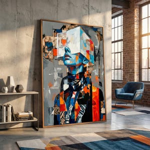 May include: Large framed abstract art print featuring a person with a geometric head and colorful patchwork clothing. The artwork uses a palette of blues, oranges, and grays, creating a modern and thought-provoking piece.