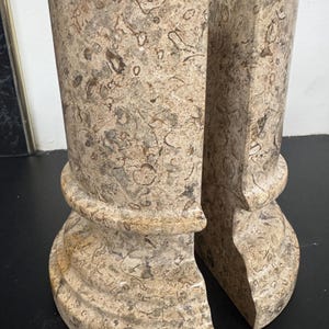 May include: A handmade wooden sign with the text "Welcome" in a playful font. The sign is painted white with a distressed finish, and a small, decorative heart is attached. The sign measures approximately 12 inches wide.