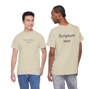 May include: Two beige t-shirts. One shirt has the text "Your Name Here" on the front. The other shirt has the text "Scripture text" on the back. Both shirts are short-sleeved.