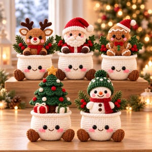 May include: Five crocheted holiday figures in white pots with smiling faces. The set includes a reindeer, Santa Claus, a gingerbread person, a Christmas tree, and a snowman, all accented with green holly leaves and red berries.