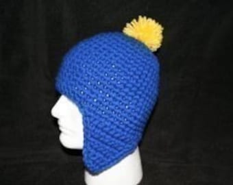 Handmade winter hat royal blue with ear flaps and a canary pom pom looks like the hat Craig wears on South park